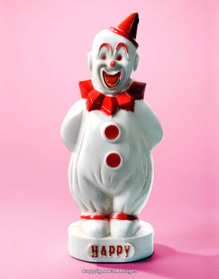 Ceramic Clown Statue with Bright Colors on a Pink Background