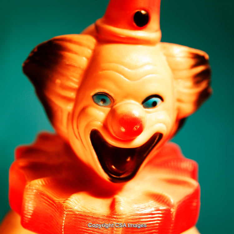 Close-Up of a Vibrant Plastic Clown Figure with Red Nose
