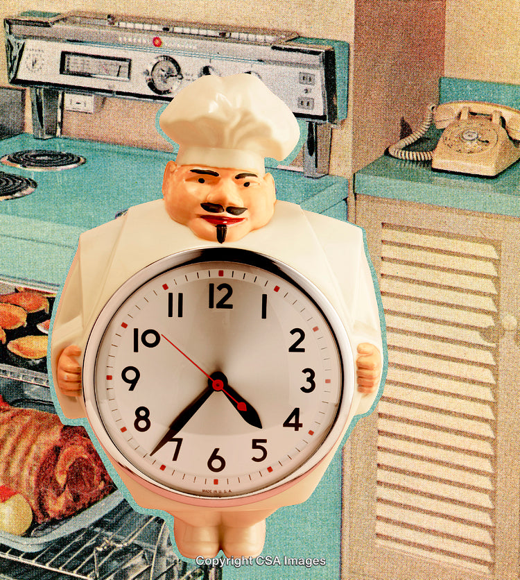 Retro Kitchen Decor Featuring Chef Holding a Clock Figurine