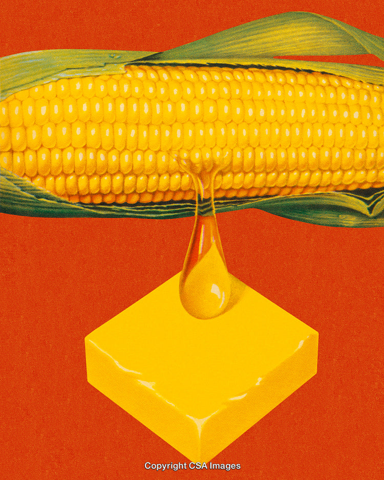 Golden Corn Cob With Melting Butter on Vibrant Red Background