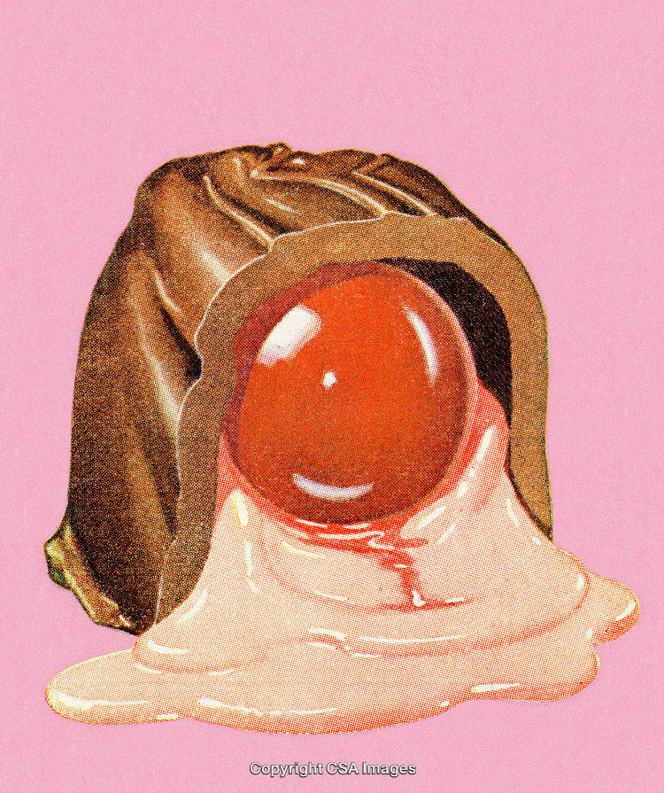 Close-Up of Chocolate Candy With Glossy Filling on Pastel Pink Background