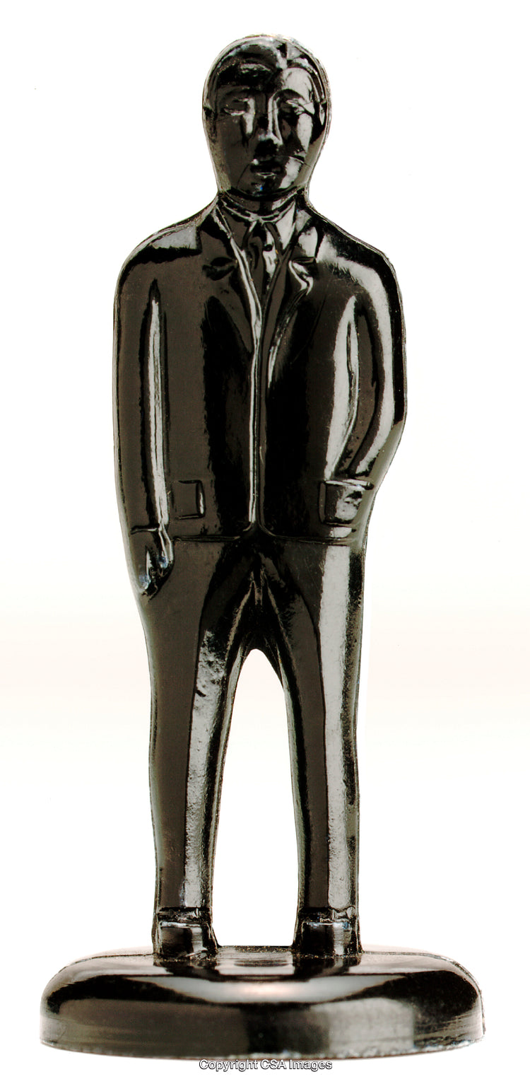 Black Figurine Depicting a Businessman Standing in a Suit and Tie