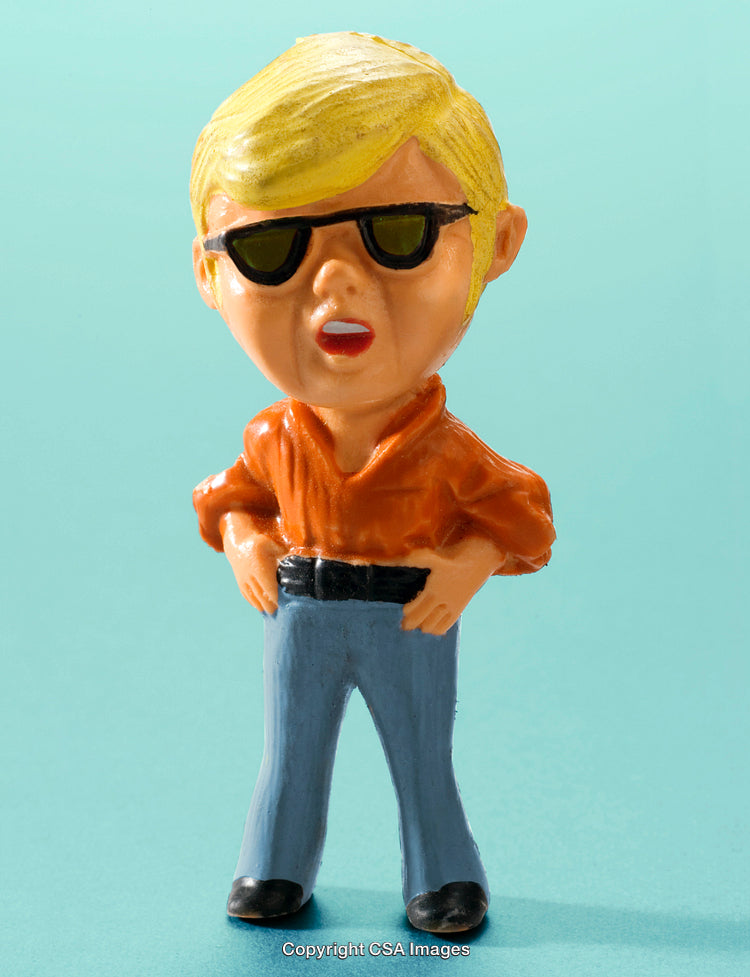 Small Plastic Figure Wearing Sunglasses and Orange Shirt on Blue Background