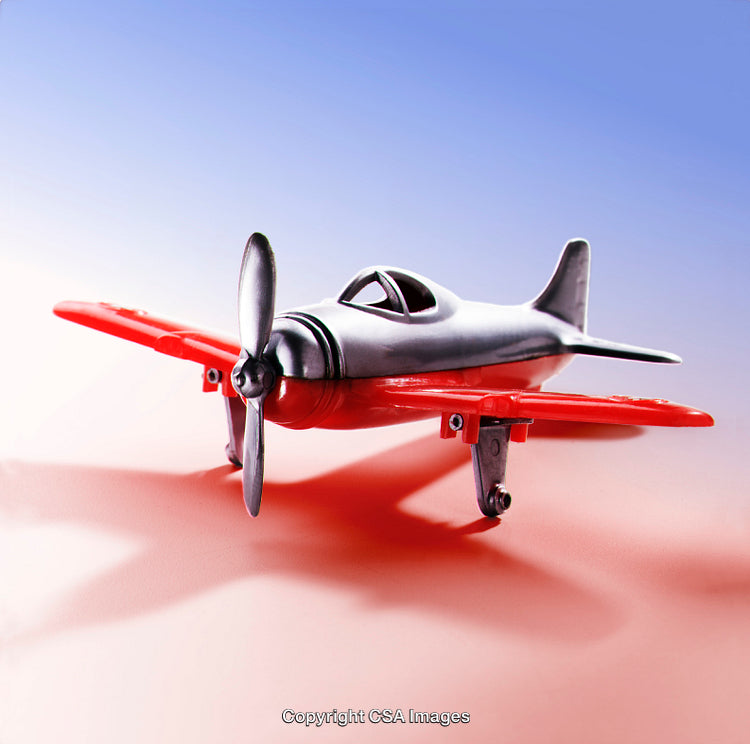Small Propeller Airplane Model on a Vibrant Gradient Background