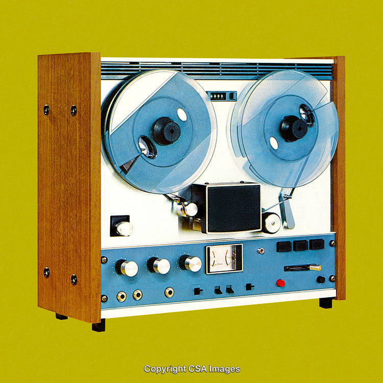 Vintage Reel-To-Reel Tape Recorder on Vibrant Green Background