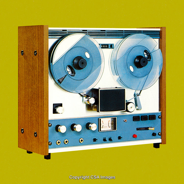 Vintage Reel-To-Reel Tape Recorder on Vibrant Green Background