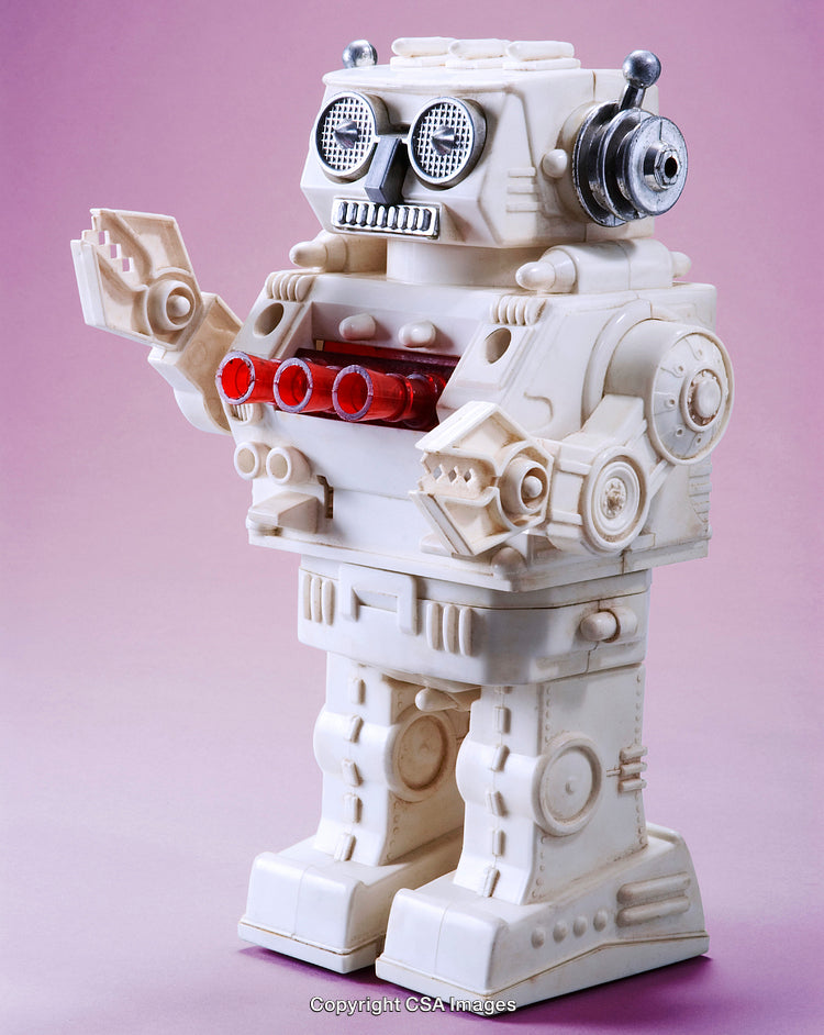 Vintage Plastic Robot Toy on Pink Background with Retro Design Appeal