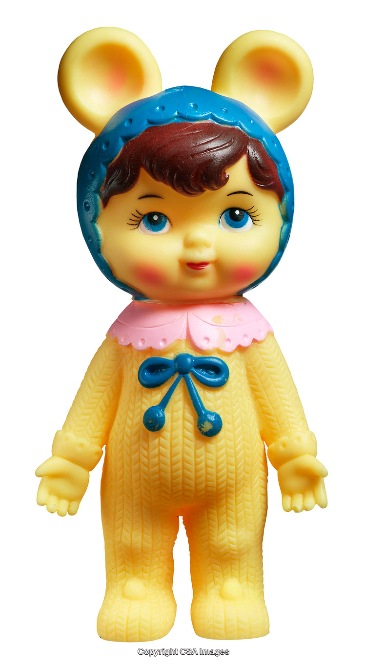 Colorful Vintage Toy Figure in a Yellow Outfit with Bow Details