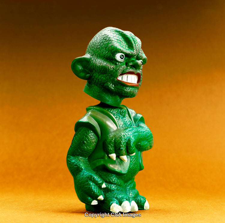 Green Plastic Toy Figure with a Detailed Reptilian Design