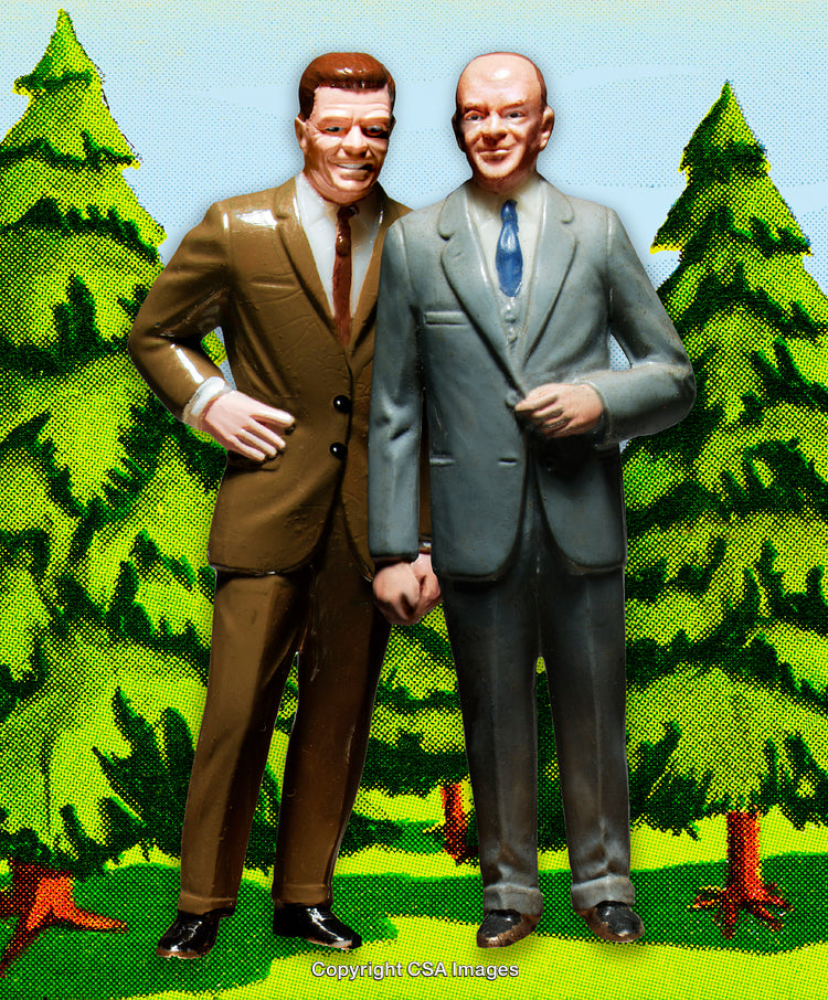Two Vintage Plastic Figures Standing Outdoors in a Forest Setting