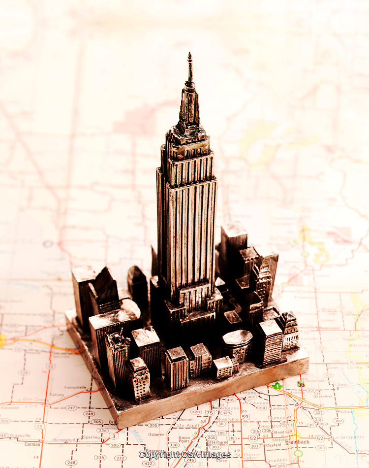 Miniature Skyline Model Featuring Iconic Skyscraper on a Map Background