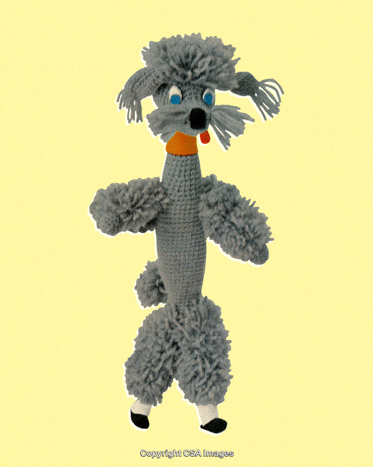 Handmade Crochet Toy Poodle on a Yellow Background