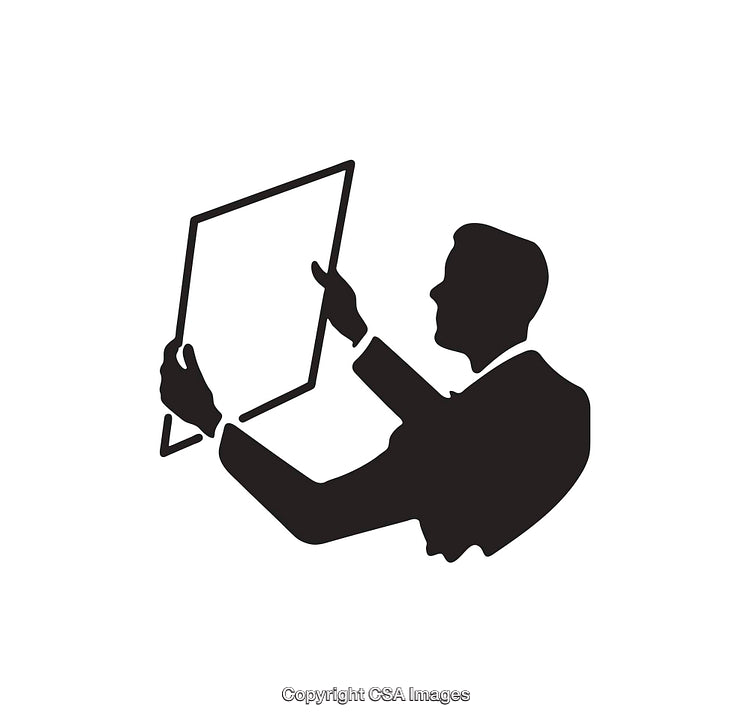 Silhouette of Individual Inspecting a Framed Object with Focused Attention
