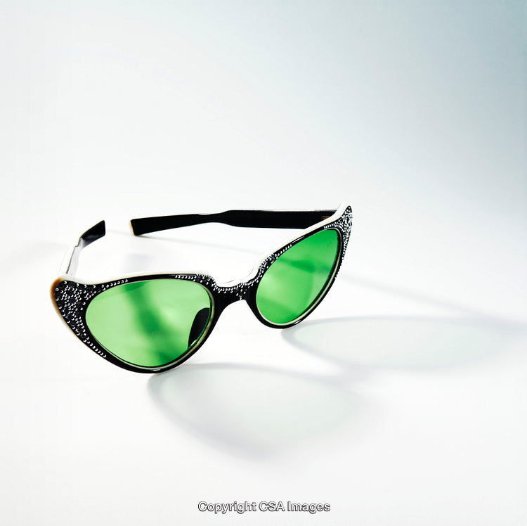 Green Lens Studded Sunglasses on White Minimalist Surface