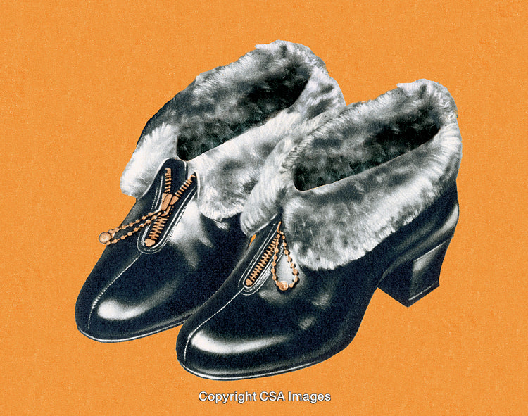 Elegant Black Shoes with Faux Fur and Zipper Details Against Orange Background