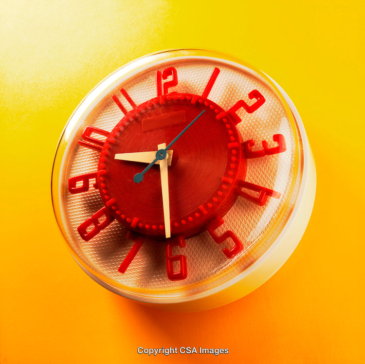 Vintage Style Red Clock on Bright Yellow Background