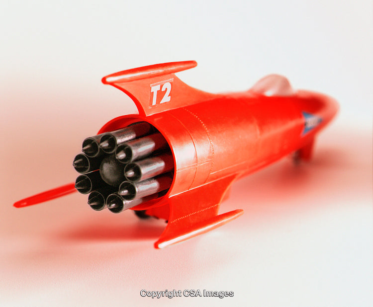 Bright Red Toy Rocketship with Engines Displayed Up Close