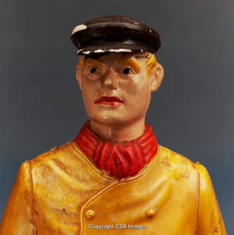 Vintage Plastic Toy Soldier Figure with Weathered Surface and Bright Uniform