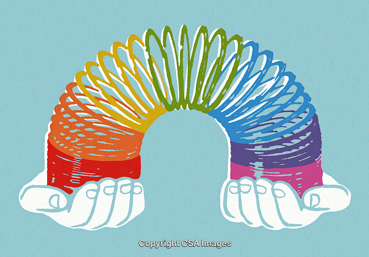 Colorful Rainbow Spring Toy Held Gently by Open Hands on Blue Background