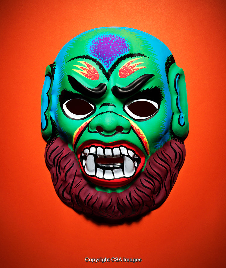 Colorful Traditional Mask on Bright Orange Background for Cultural Art Themes
