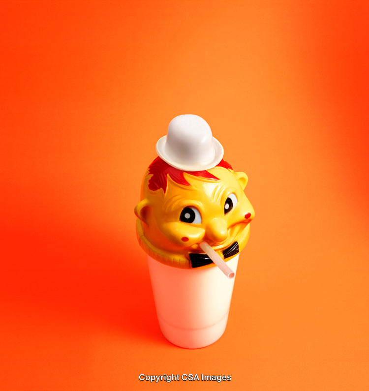 Bright Yellow Toy Drink Container with Cheerful Character Face on Orange Background