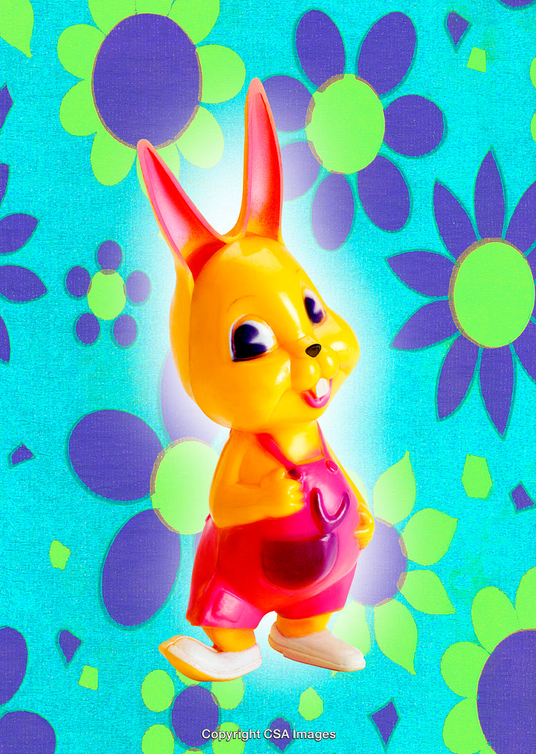 Colorful Plastic Bunny Toy with Bright Floral Background