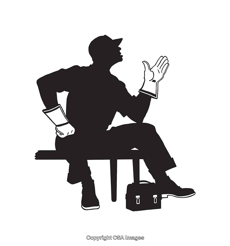 Silhouette of a Worker Gesturing While Sitting with Tools
