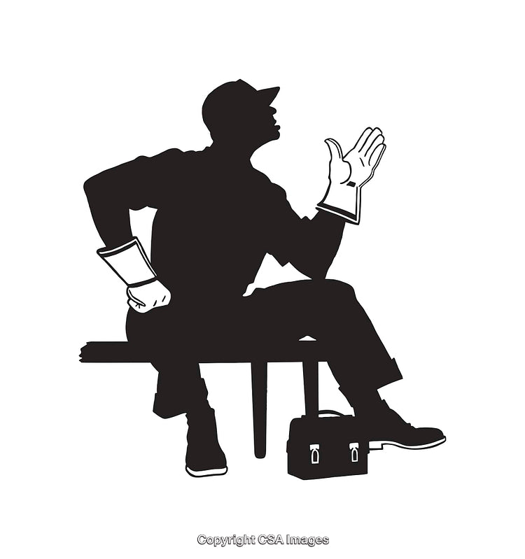 Silhouette of a Worker Gesturing While Sitting with Tools