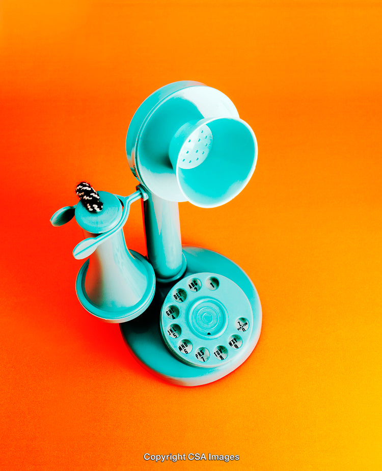 Vintage Teal Telephone Toy on Bright Warm Color Background