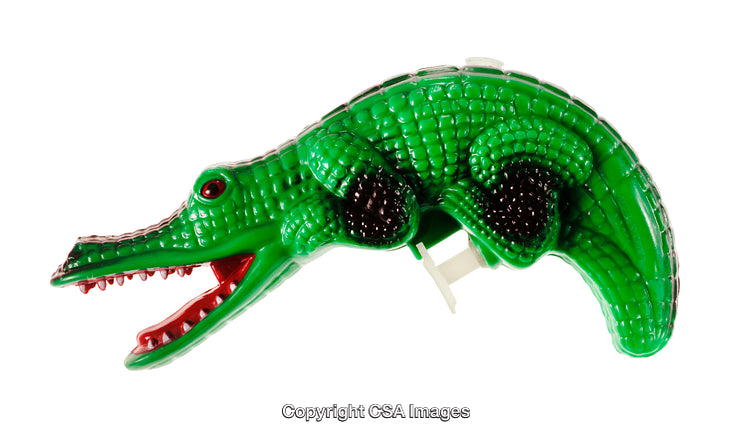 Green Plastic Crocodile Toy with Articulated Jaw Posed on White Background