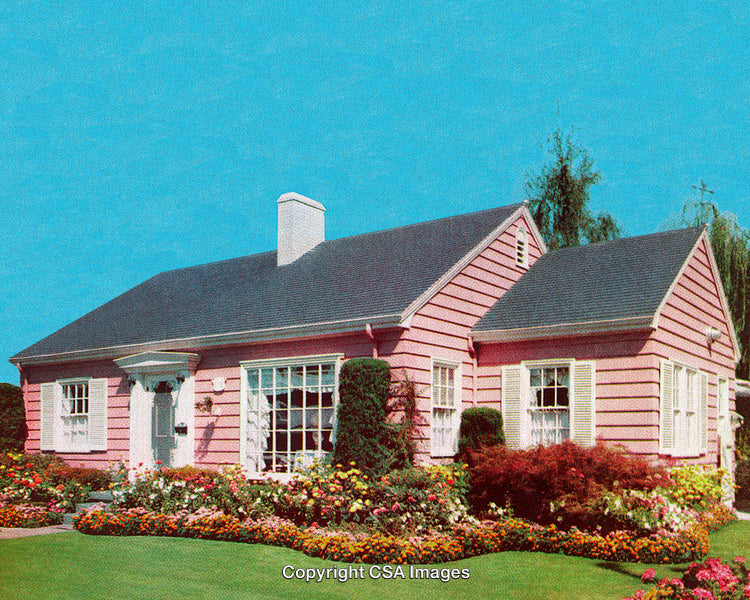 Charming Pink Suburban House with Vibrant Garden Under Clear Blue Sky