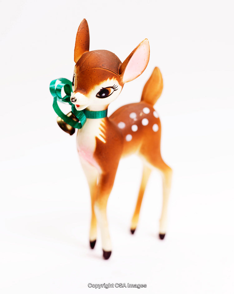 Adorable Deer Figurine With Festive Green Ribbon Decoration in Close-Up View