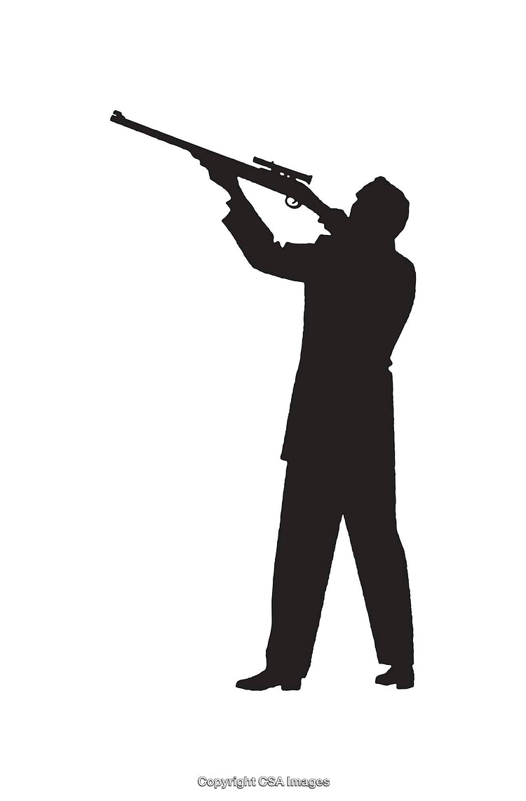 Silhouette of a Man Holding a Rifle and Taking Aim Outdoors