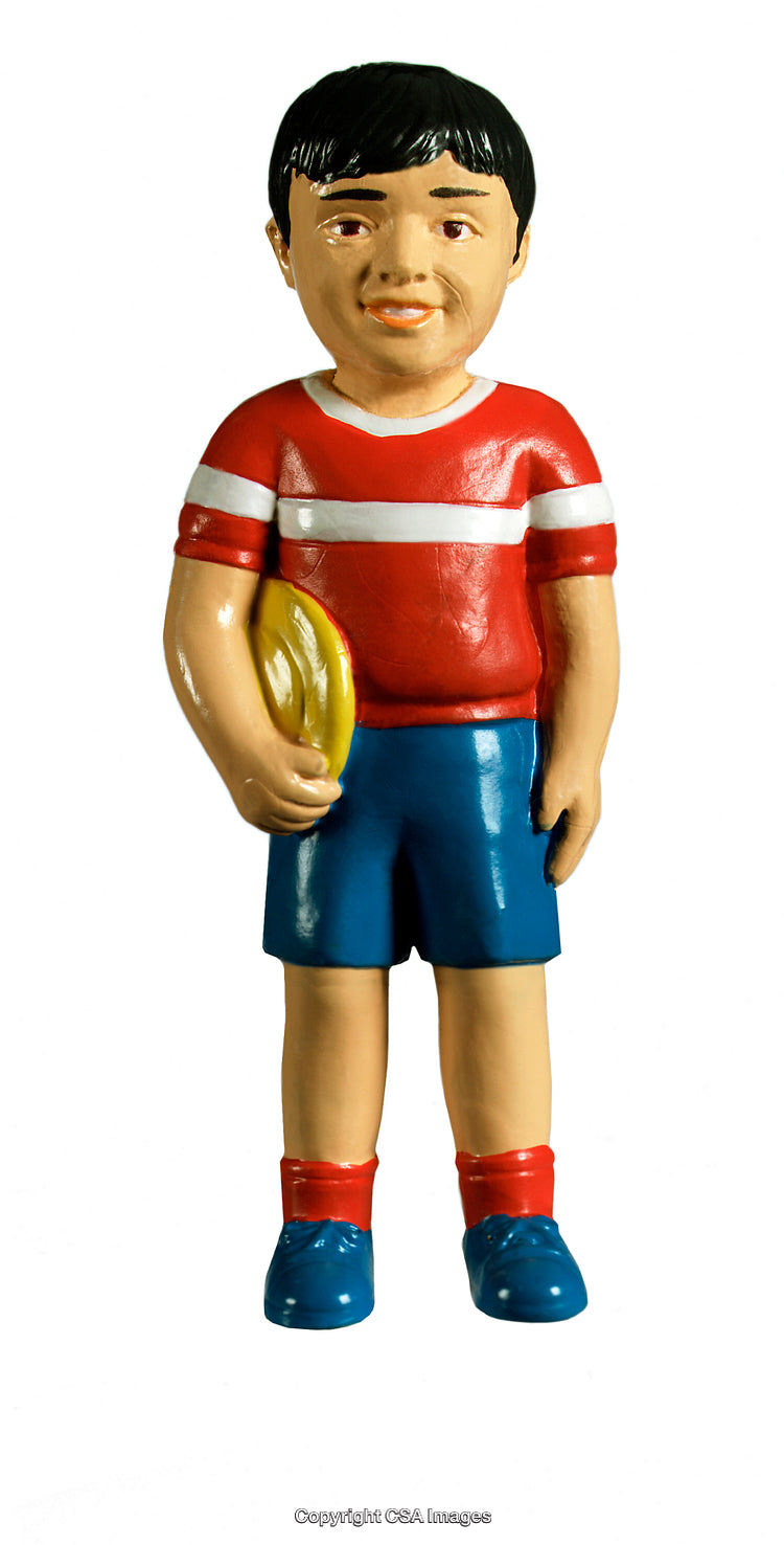 Colorful Toy Figure of a Child Holding a Yellow Ball