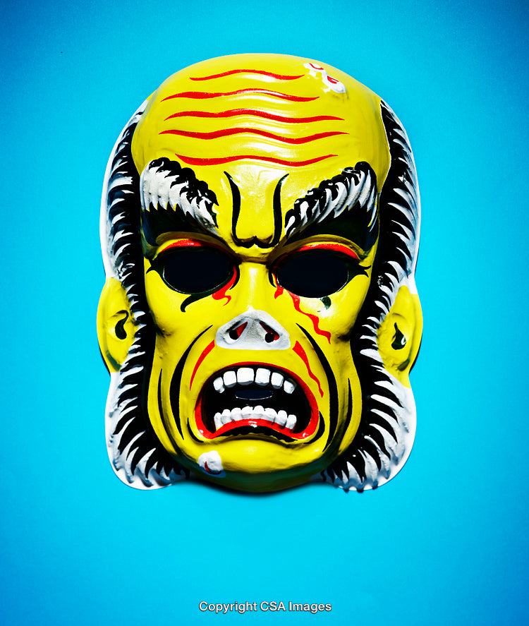 Yellow Monster Mask with Angry Expression on Blue Background