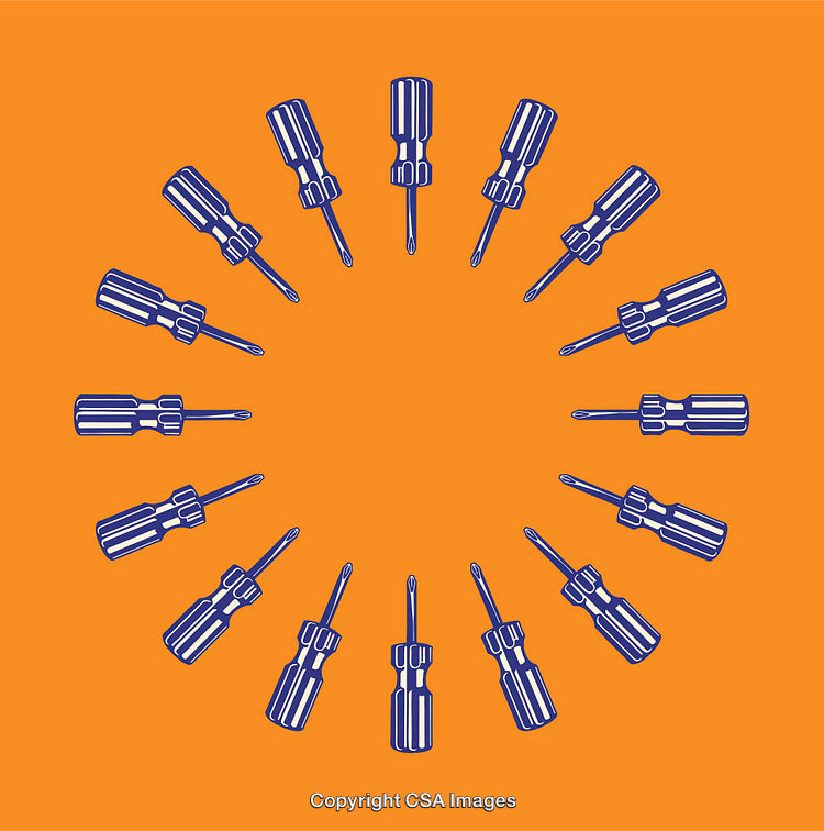 Circular Arrangement of Screwdrivers on Vibrant Orange Background