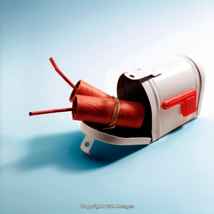 Miniature Model of Mailbox with Explosive Sticks and Blue Background