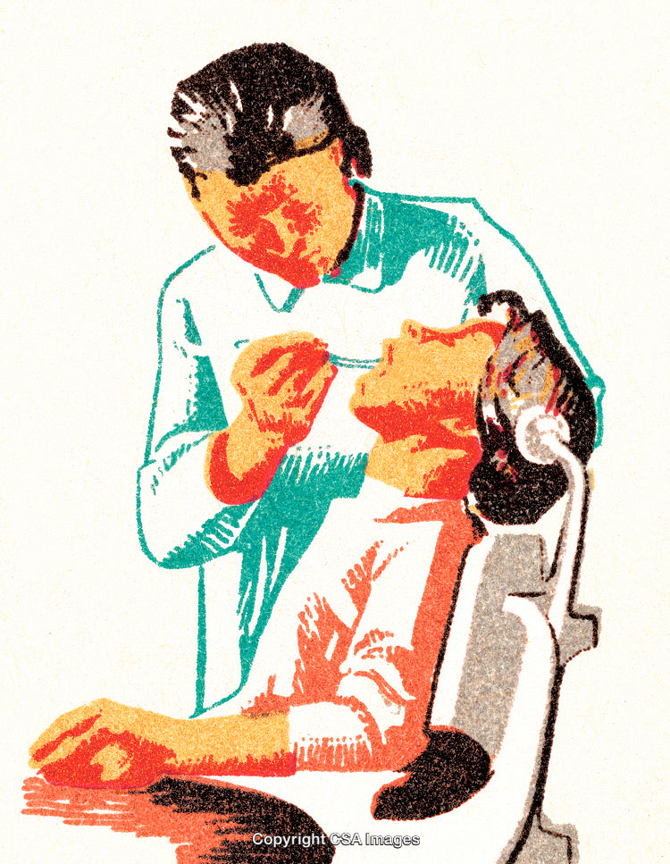 Dentist Examining Patient in Dental Chair During Checkup