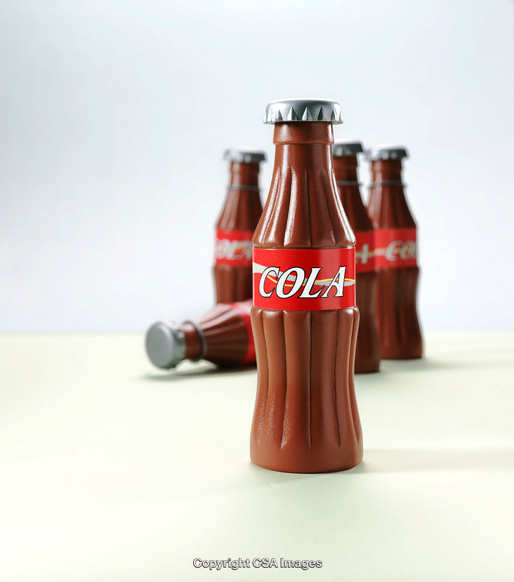 Close-Up of Plastic Cola Bottle Toys in Focus