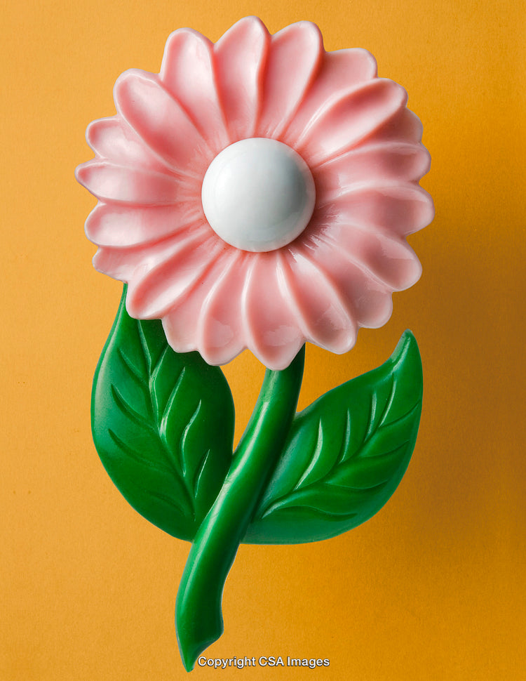 Colorful Plastic Flower Toy on Orange Background for Decorative Use