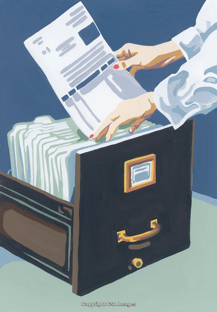 Hands Filing Important Papers Into an Organized Storage Drawer