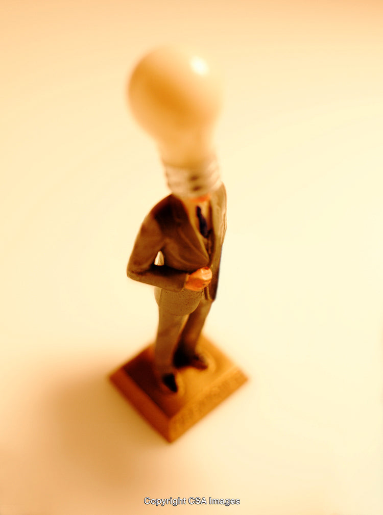 Light Bulb Figurine Depicting Businessman In Creative Pose
