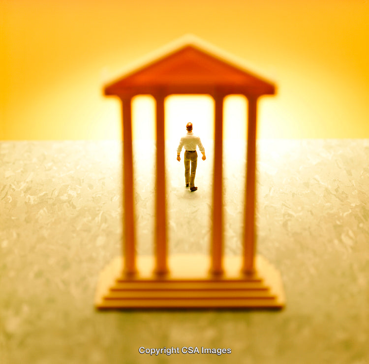Miniature Figure Walking Through a Small Temple-Like Structure at Golden Hour