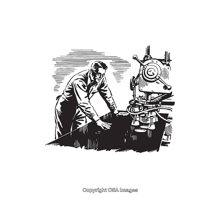 Black and White Worker Operating Machinery in a Technical Setting