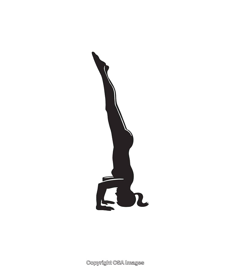 Silhouette of a Person Performing a Headstand in a Yoga Pose