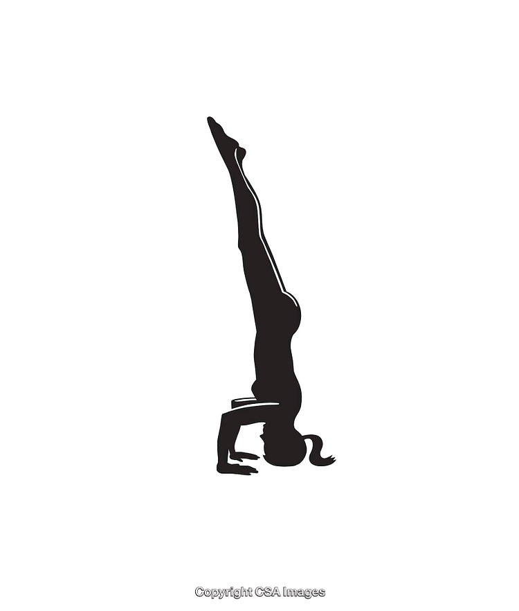 Silhouette of a Person Performing a Headstand in a Yoga Pose