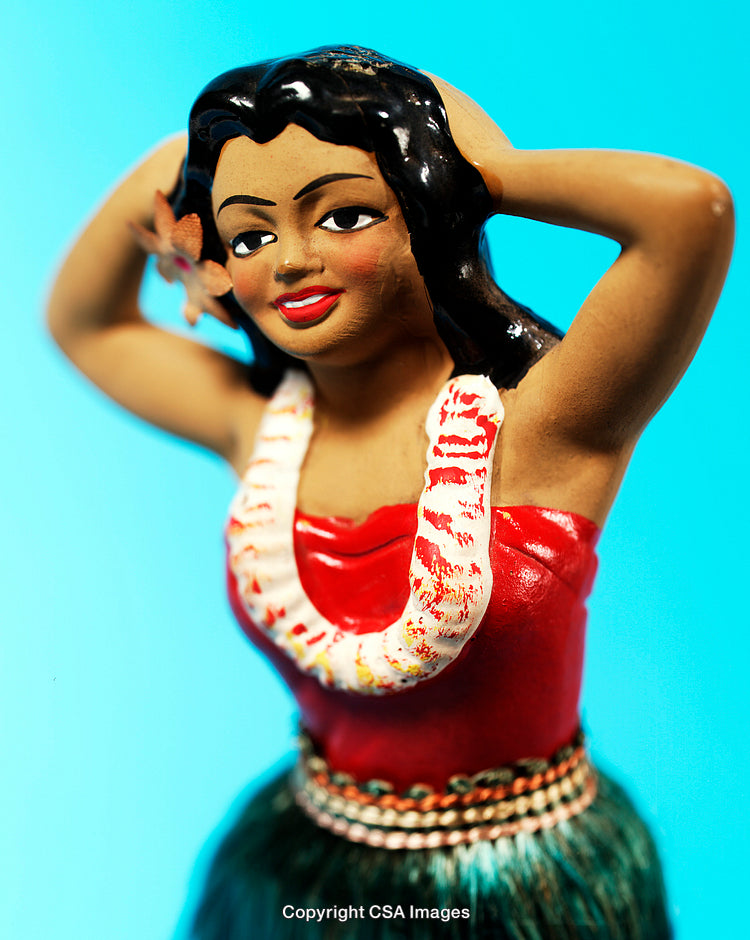 Hula Dancer Figurine With Traditional Hawaiian Attire on Blue Background