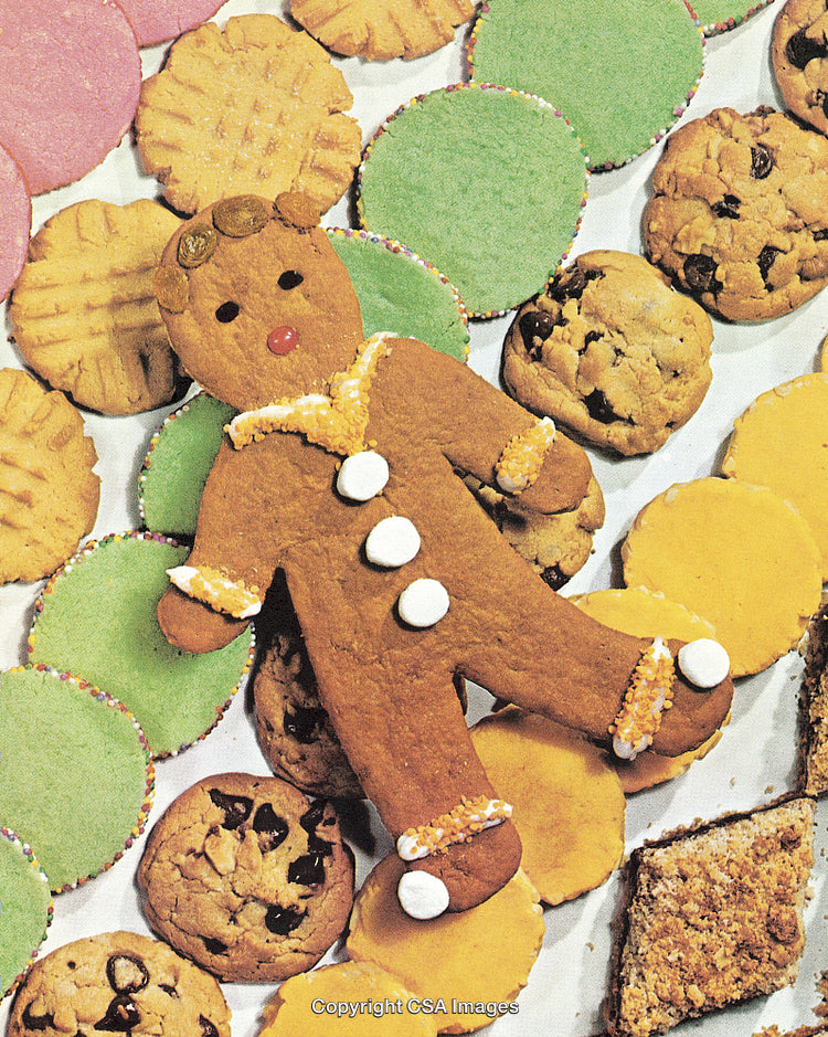 Colorful Assortment of Holiday Cookies Featuring a Gingerbread Man Centerpiece