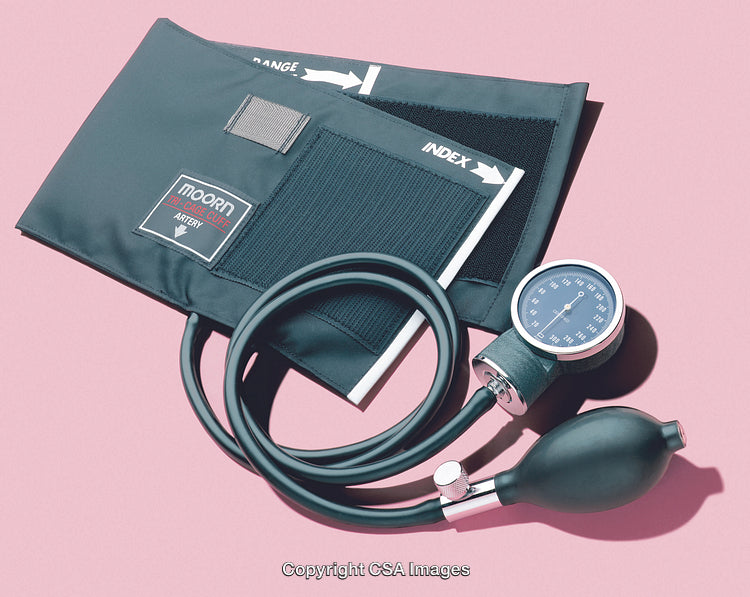 Traditional Blood Pressure Monitor on Pink Background