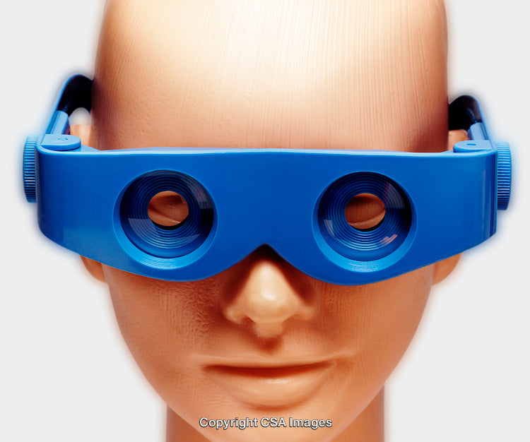 Blue Toy Goggles on a Doll Head Isolated on White Background